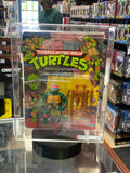 Michaelangelo -10 Back Hard Head- (TMNT Mutant Ninja, Playmates) AFA 85 product image 1, provided for visual reference and