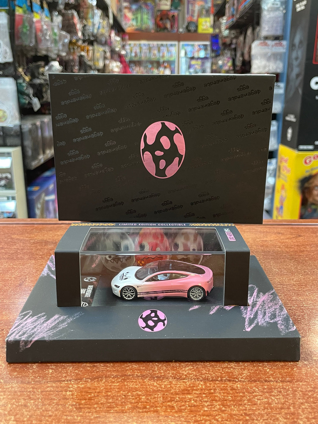 Degenerate Eggs Pink Tesla 1/64 (NVRLAND Collectibles, Diecast ) SEALED product image 1, provided for visual reference and