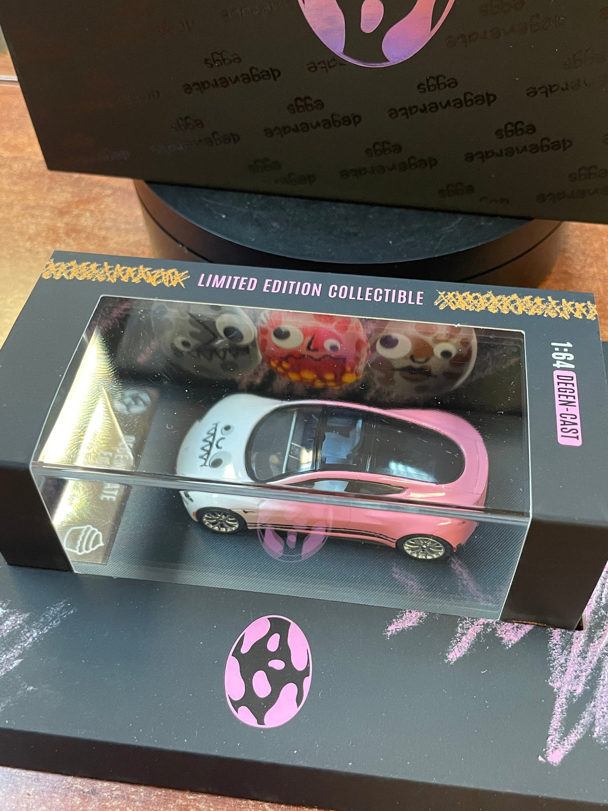 Degenerate Eggs Pink Tesla 1/64 (NVRLAND Collectibles, Diecast ) SEALED product image 2, provided for visual reference and
