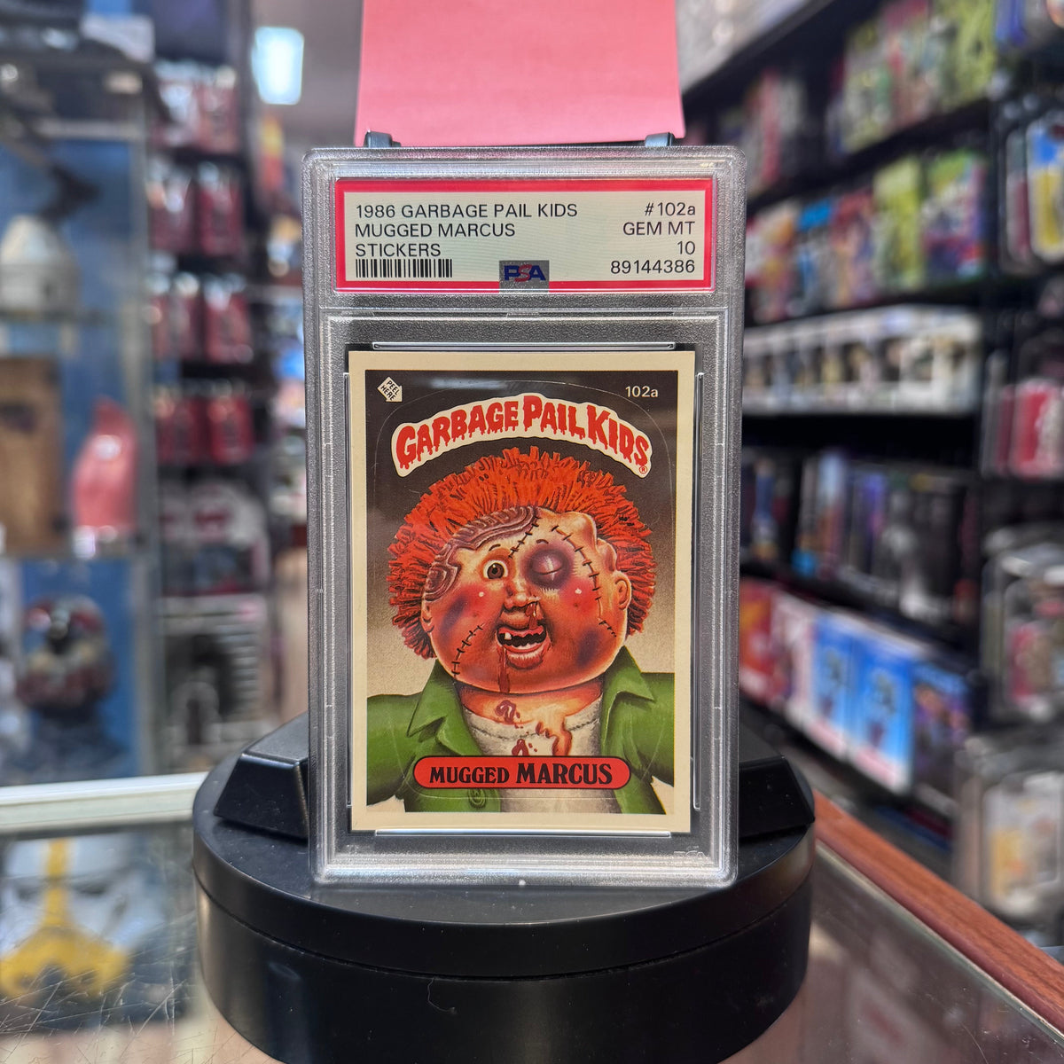 Mugged Marcus #102a GEM MT 1986 (Garbage Pail Kids, TOPPS) **PSA 10** product image 1, provided for visual reference and